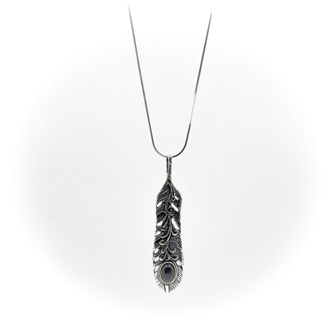 Krishna's feather pendant